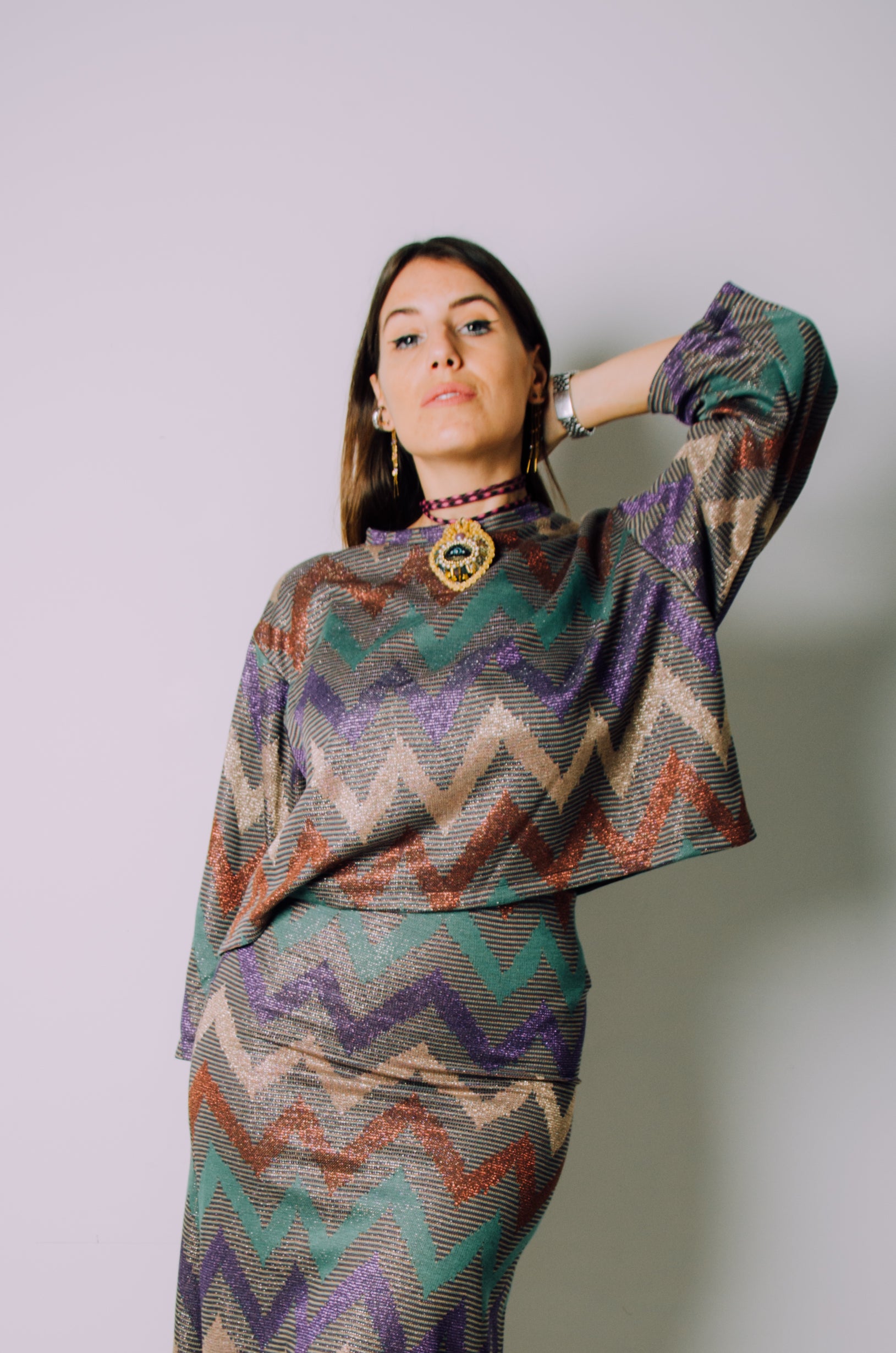 Top in maglina modello con fantasia in lurex a zig zag