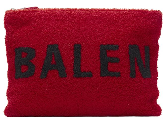 Borsa clutch con zip in shearling di agnello merino tinto con il logo Demna di Balenciaga Rosso